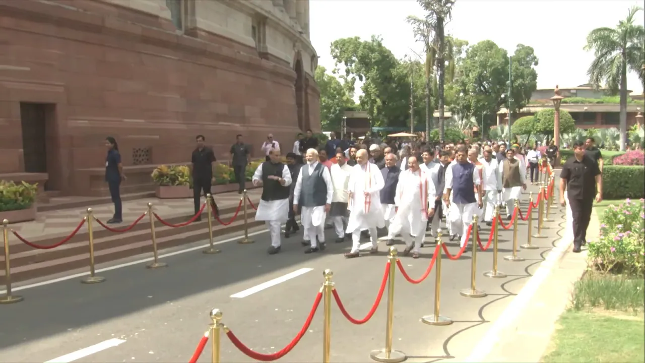 Prime Minister Narendra Modi with Union Ministers Amit Shah, Rajnath Singh and Nitin Gadkari, BJP MP JP Nadda and other parliamentarians walks towards the new Parliament building, in New Delhi