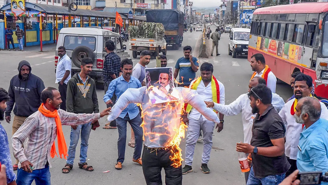 Kannada activists burn an effigy of Tamil Nadu CM M K Stali during the Karnataka bandh called against release of Cauvery water to Tamil Nadu, in Chikmagalur