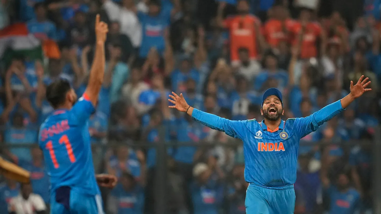 Rohit Sharma and Mohammed Shami celebrate after winning the ICC Men's Cricket World Cup 2023 first semi-final match against New Zealand, at the Wankhede Stadium, in Mumbai, Wednesday, Nov. 15, 2023