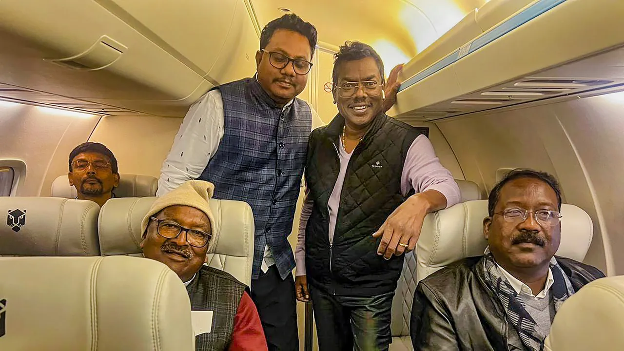 JMM-led ruling alliance’s MLA and JMM leader Hemant Soren’s brother Basant Soren with other MLAs onboard a flight to Hyderabad
