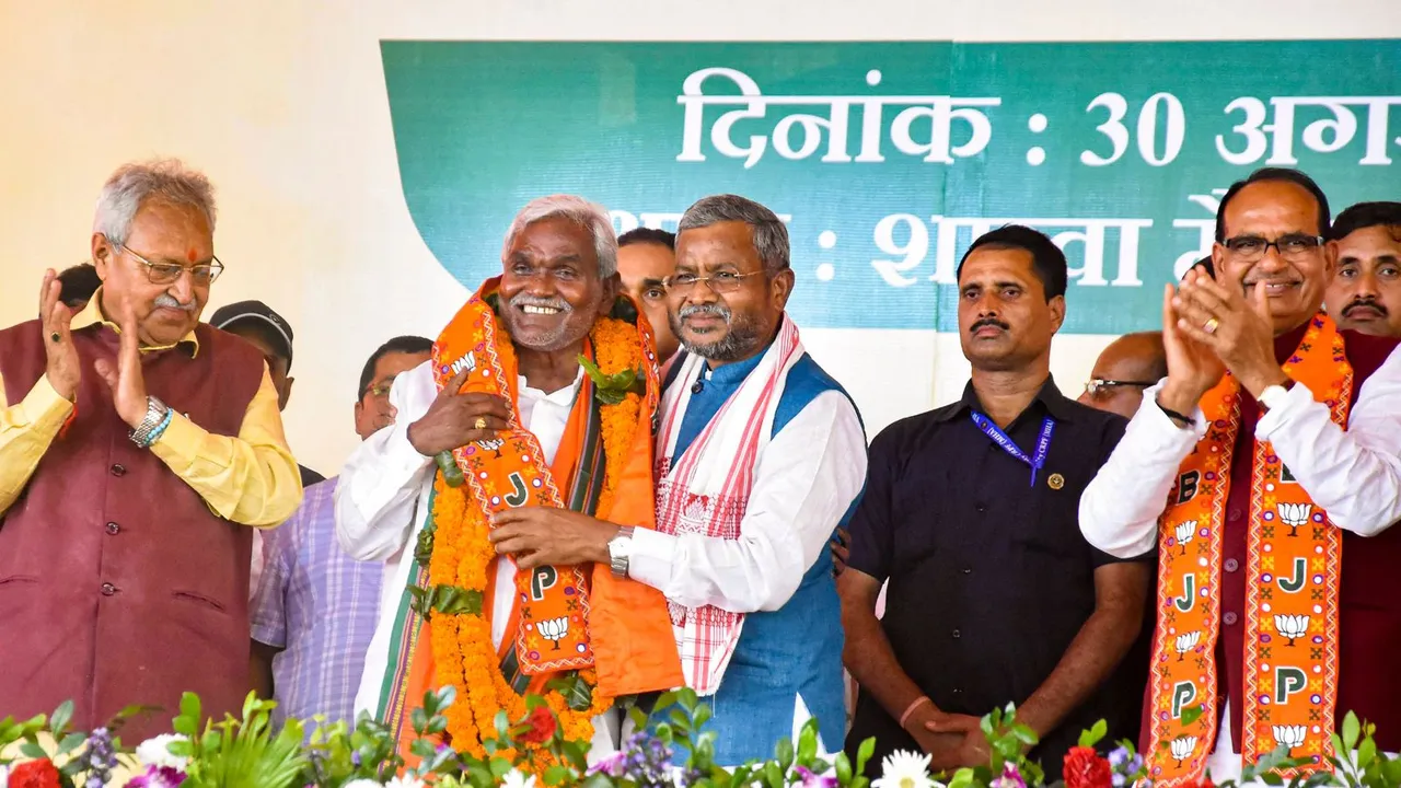 Former Jharkhand chief minister Champai Soren being felicitated by Union Minister Shivraj Singh Chouhan and Jharkhand BJP President Babulal Marandi as the former joined BJP during a ceremony, in Ranchi, Friday, Aug. 30, 2024.