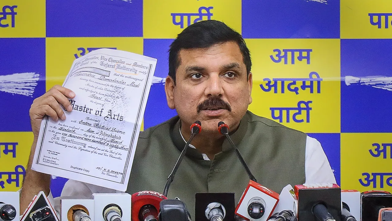 Aam Aadmi Party (AAP) MP Sanjay Singh shows a document during a press conference at party office in New Delhi on April 2