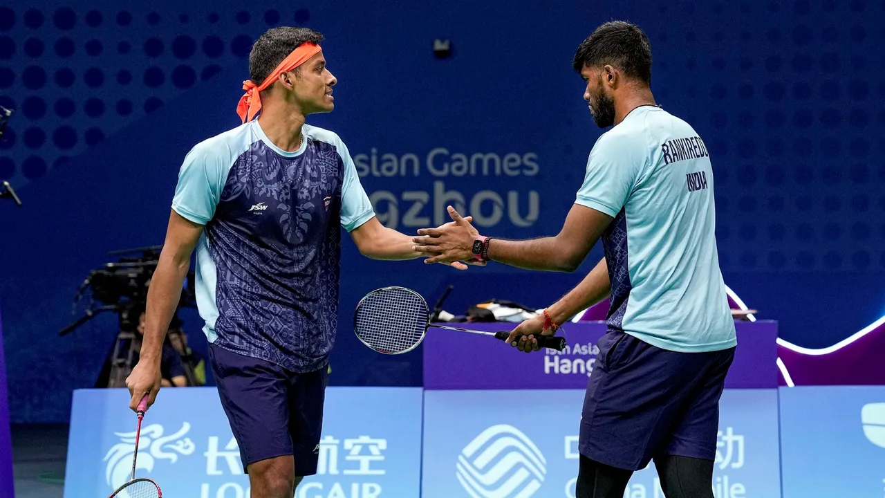 India’s Satwiksairaj Rankireddy and Chirag Shetty celebrate a point against Korea's Choi Solgyu and Kim Wonho during Men's Doubles Gold Medal badminton match at the 19th Asian Games