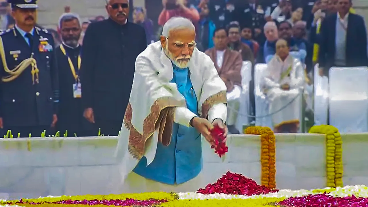 Prime Minister Narendra Modi pays floral tribute to Mahatma Gandhi at Rajghat on Martyrs' Day, observed to mark the death anniversary of the father of the nation, in New Delhi