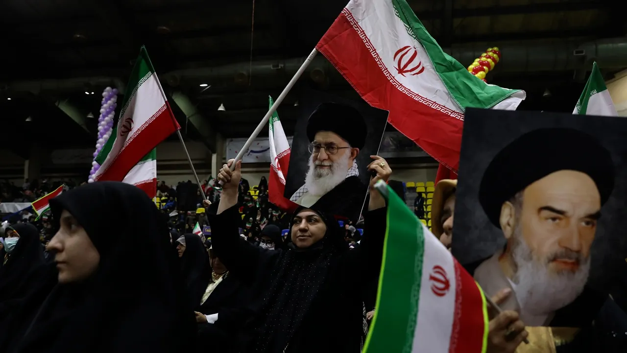 Iranian women wave their country’s flags as they hold posters of the Supreme Leader Ayatollah Ali Khamenei, centre, and the late revolutionary founder Ayatollah Khomeini during an election campaign rally, Tuesday, Feb. 27, 2024. 