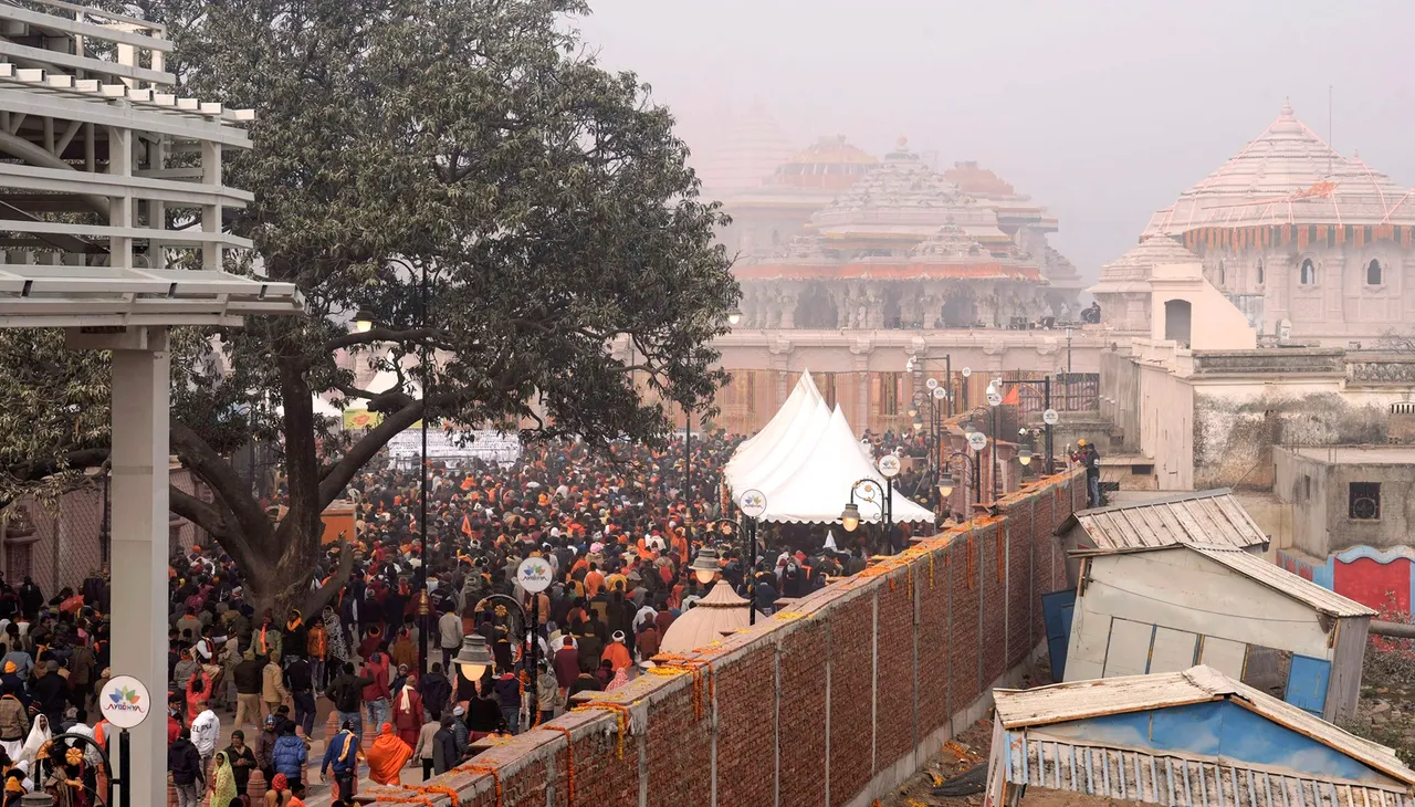 Devotees gather to enter the Ram temple, in Ayodhya, Tuesday, Jan. 23, 2024