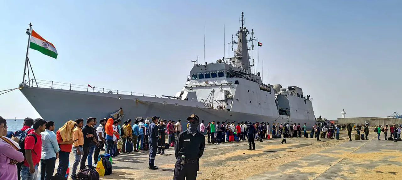 Stranded Indians queue up to board INS Sumedha as they leave violence-hit Sudan for Jeddah under 'Operation Kaveri', in Port Sudan
