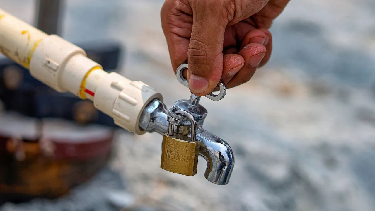 A locked water tap amid the ongoing water crisis, in Bengaluru