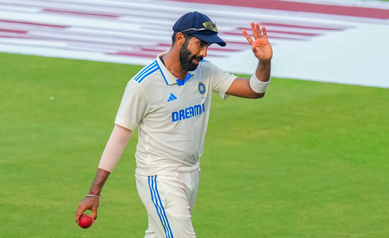 India's bowler Jasprit Bumrah, who took 6 wickets, shows the ball at the end of the first innings of England