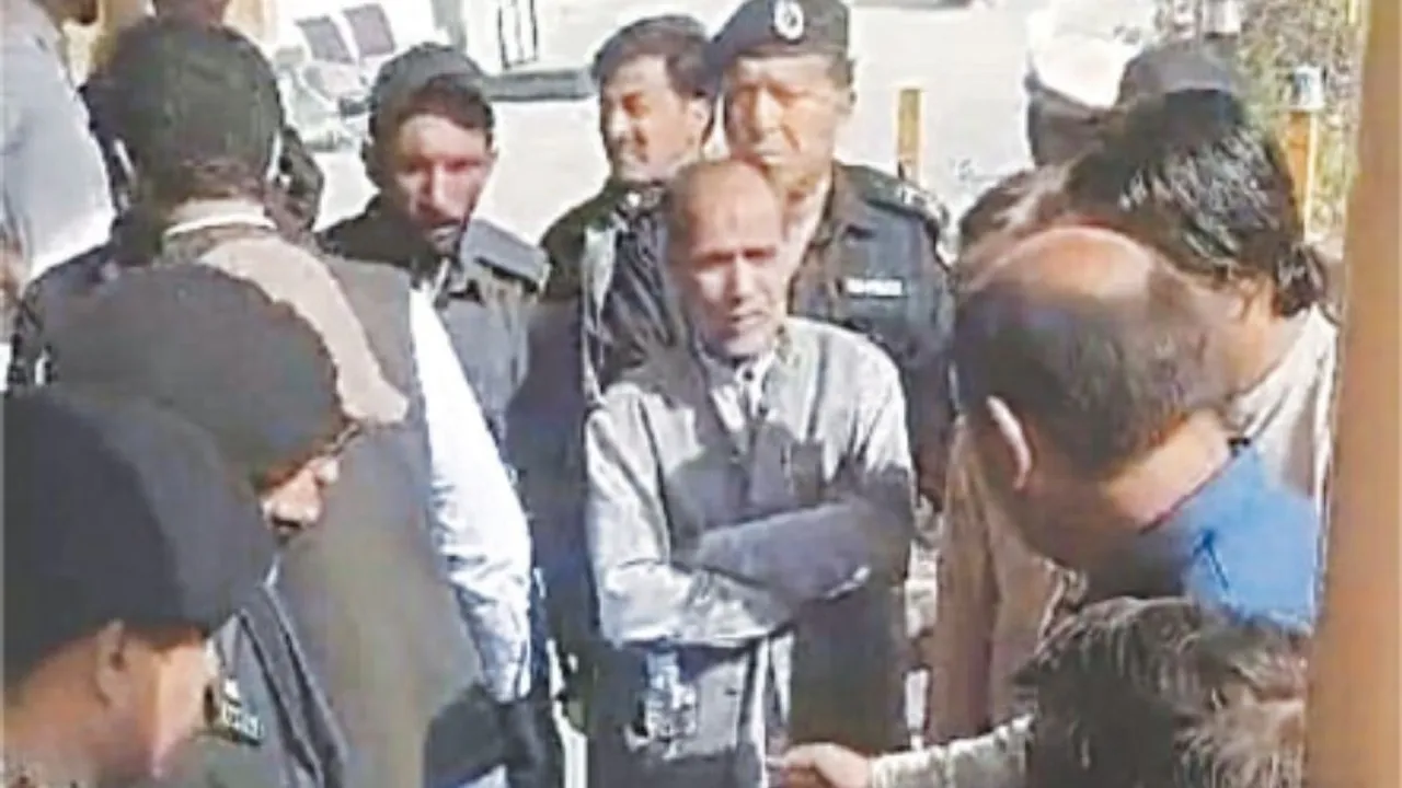 Officials of PIA, the Civil Aviation Authority and police try to placate the protesting father of the deceased