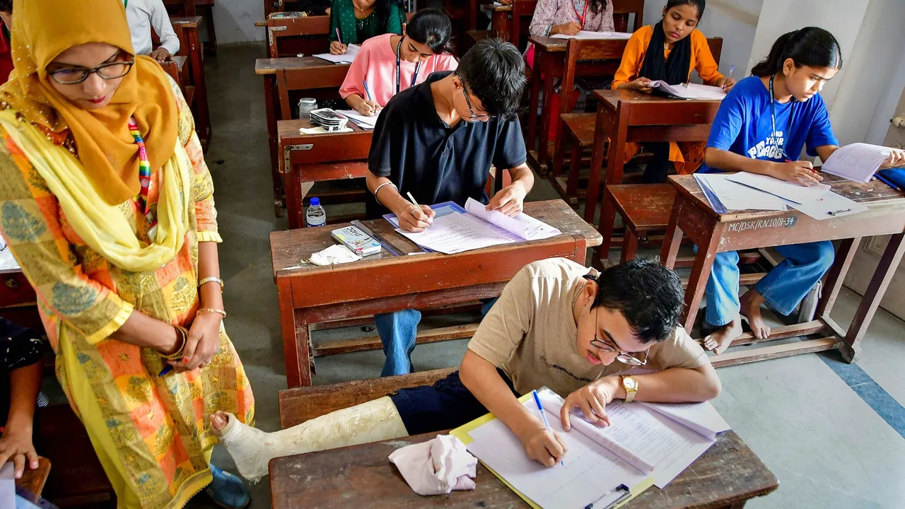 Students write a Maharashtra Board’s HSC exam at an examination centre at Nagpada, in Mumbai