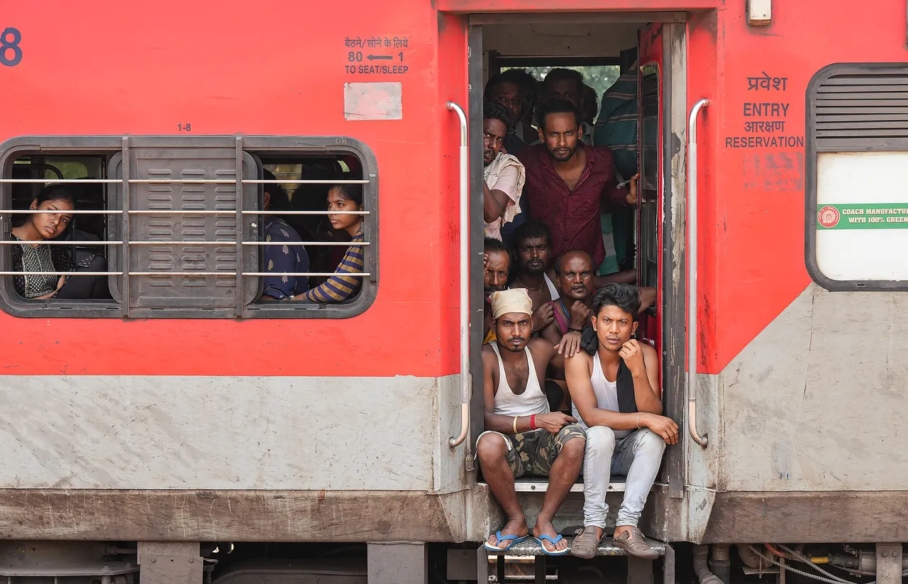 Passengers inside the Coromandel Express train as it leaves from Bahanaga Bazar railway station