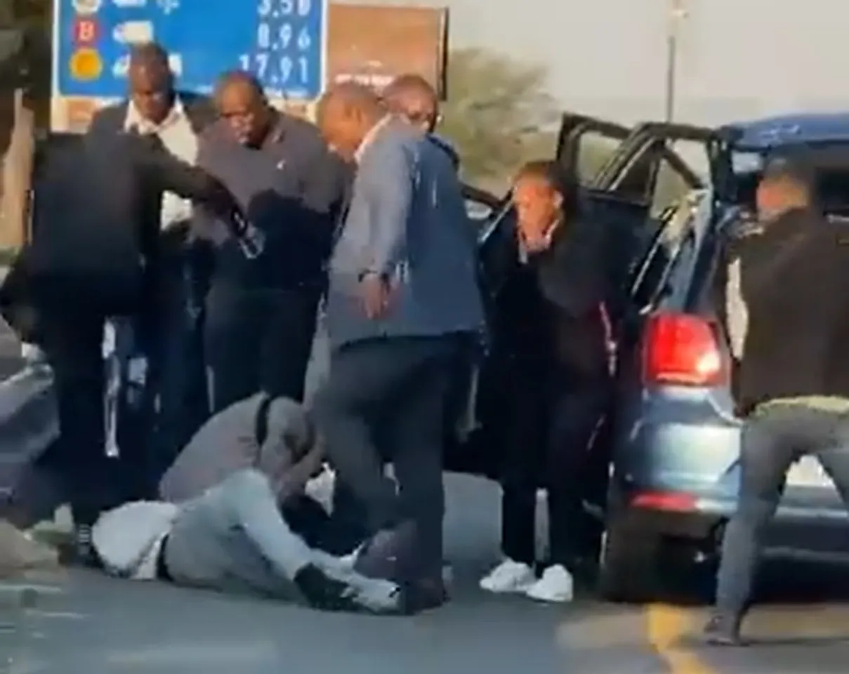 Outrage in South Africa over video of armed police officers stomping on man's head