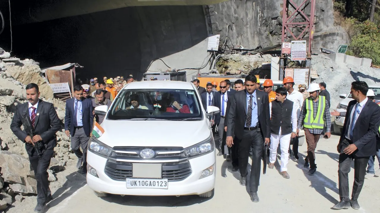 Nitin Gadkari and Uttarakhand Chief Minister Chief Minister Pushkar Singh Dhami leave after reviewing the rescue operation after a portion of an under-construction tunnel between Silkyara and Dandalgaon on the Brahmakhal-Yamunotri national highway collapsed, in Uttarkashi district, Sunday, Nov. 19, 2023.