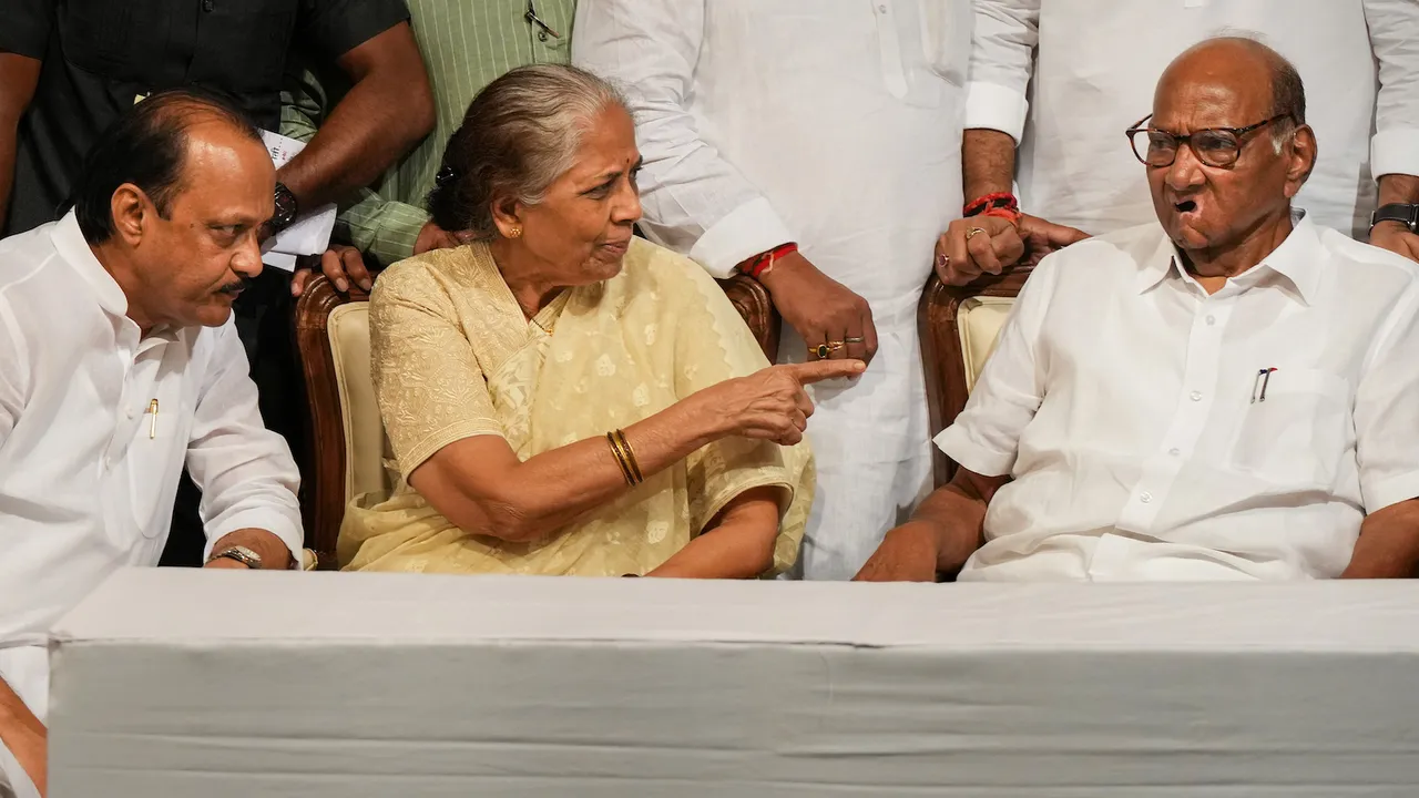 Sharad Pawar with his wife and party leader Ajit Pawar during a book launch event on May 2