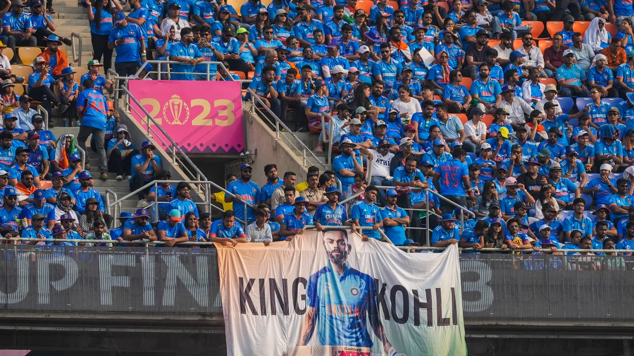 Indian fans hold a banner of Indian batsman Virat Kohli during the ICC Men’s Cricket World Cup 2023 final between India and Australia, at the Narendra Modi Stadium