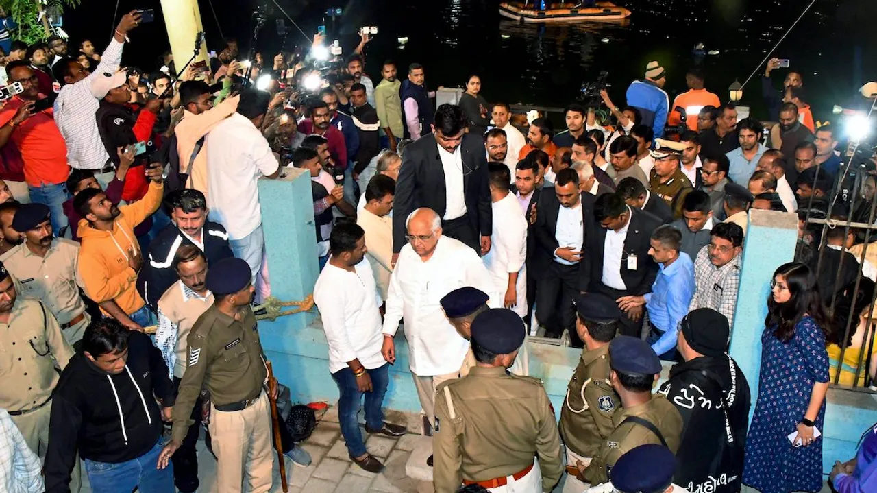 Bhupendra Patel and Home Minister Harsh Sanghvi visit the accident site where a boat carrying school students capsized in a lake, in Vadodara, Thursday, Jan. 18, 2024. 14 students, 2 teachers died in this accident.