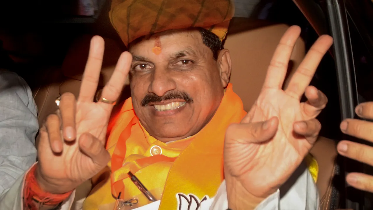 BJP MLA Mohan Yadav shows victory signs after being elected as the leader of the state legislative party, in Bhopal, Monday, Dec. 11, 2023. Yadav will be the next CM of the state.