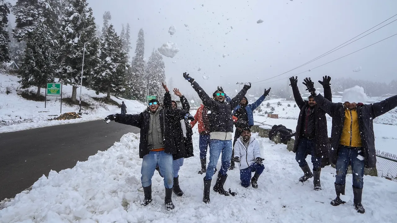 Tourists at the ski resort of Gulmarg amid light snowfall, in Baramulla district of north Kashmir,