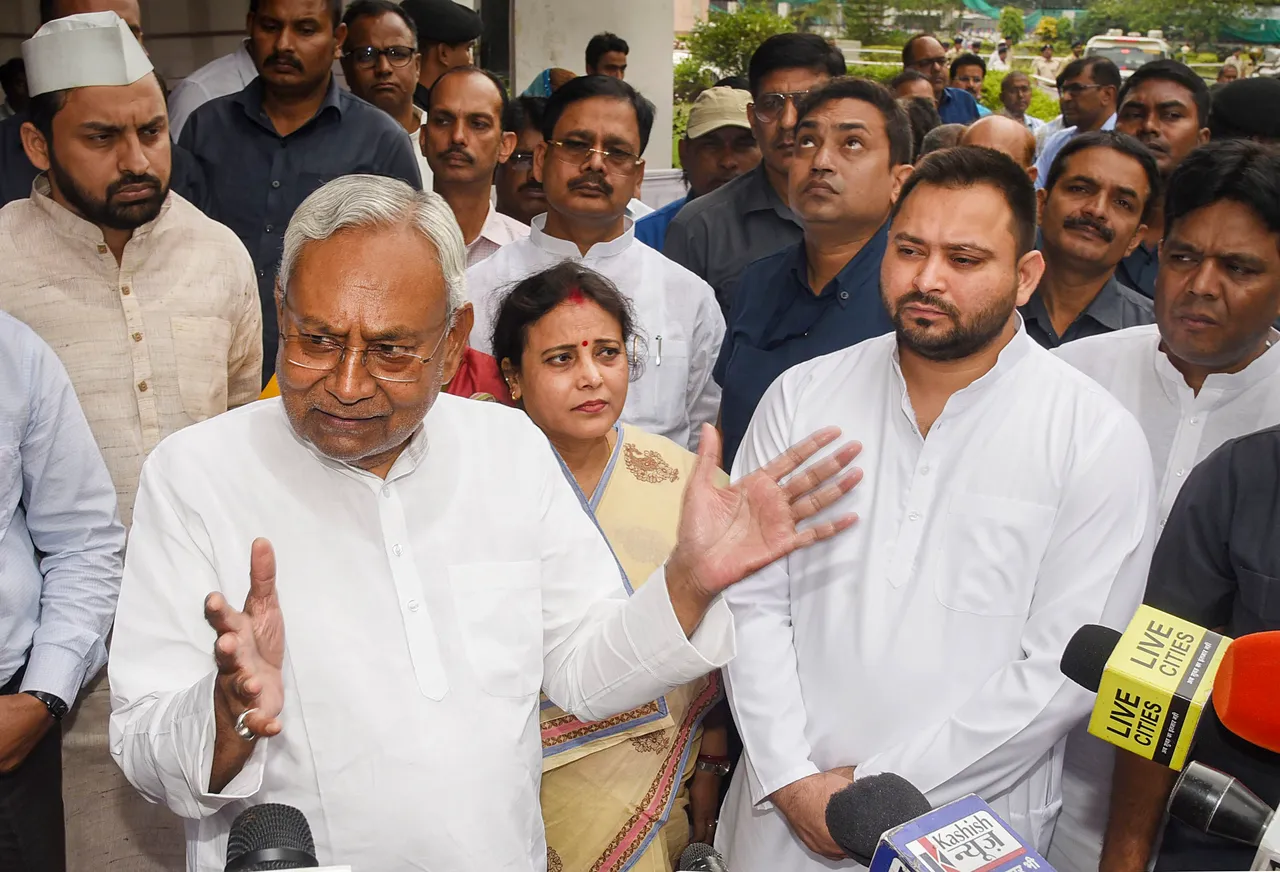Bihar Chief Minister Nitish Kumar with Deputy Chief Minister Tejashwi Yadav speaks with the media during an event, in Patna