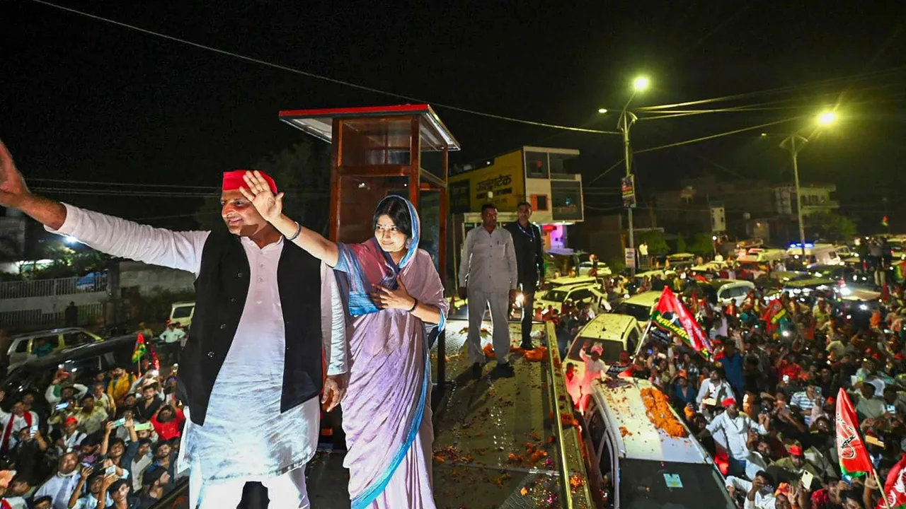 Samajwadi Party President Akhilesh Yadav with Party candidate and his wife Dimple Yadav during a rally for Lok Sabha elections, in Mainpuri, Saturday, May 4, 2024