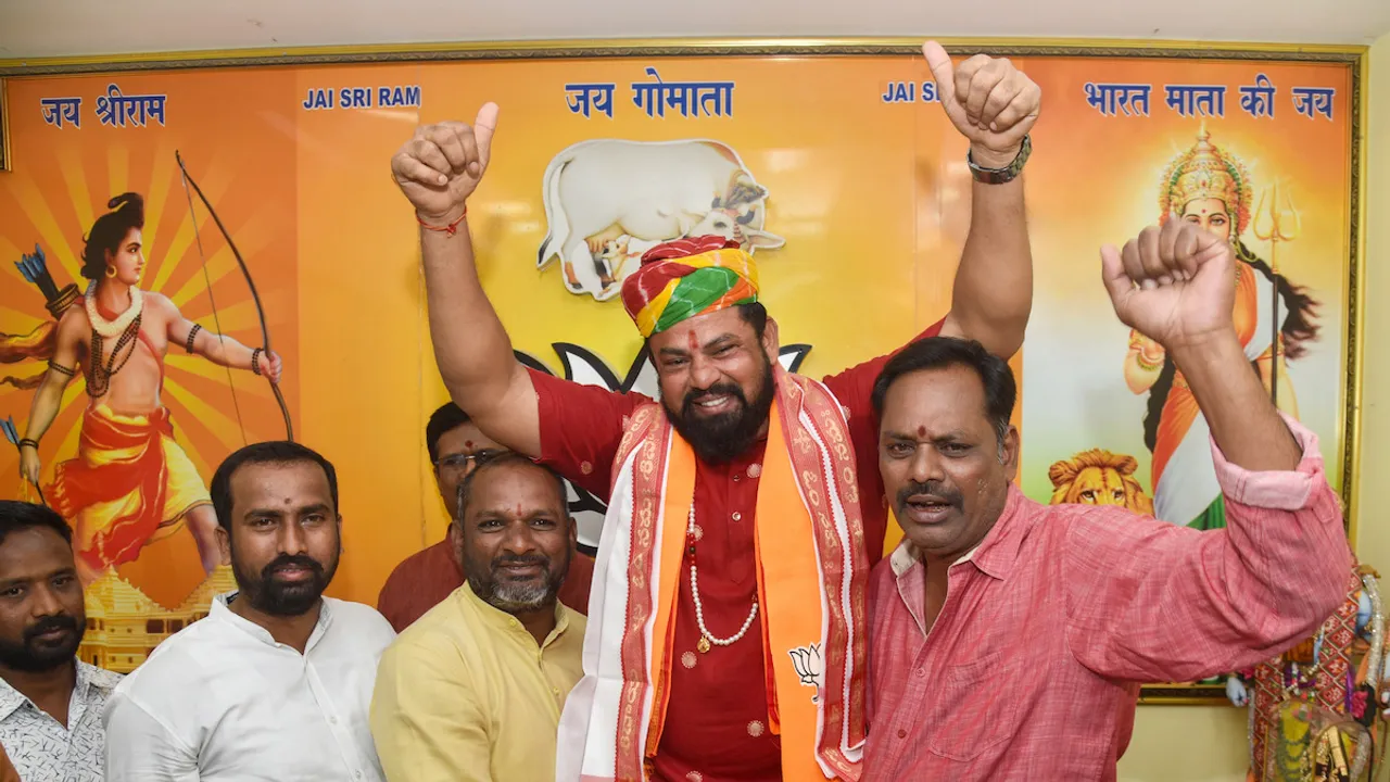 BJP MLA T Raja Singh celebrates after the party lifted his suspension allowing him to be a candidate for the Goshamahal assembly seat for the upcoming Telangana Assembly polls, in Hyderabad, Sunday, Oct. 22, 2023.