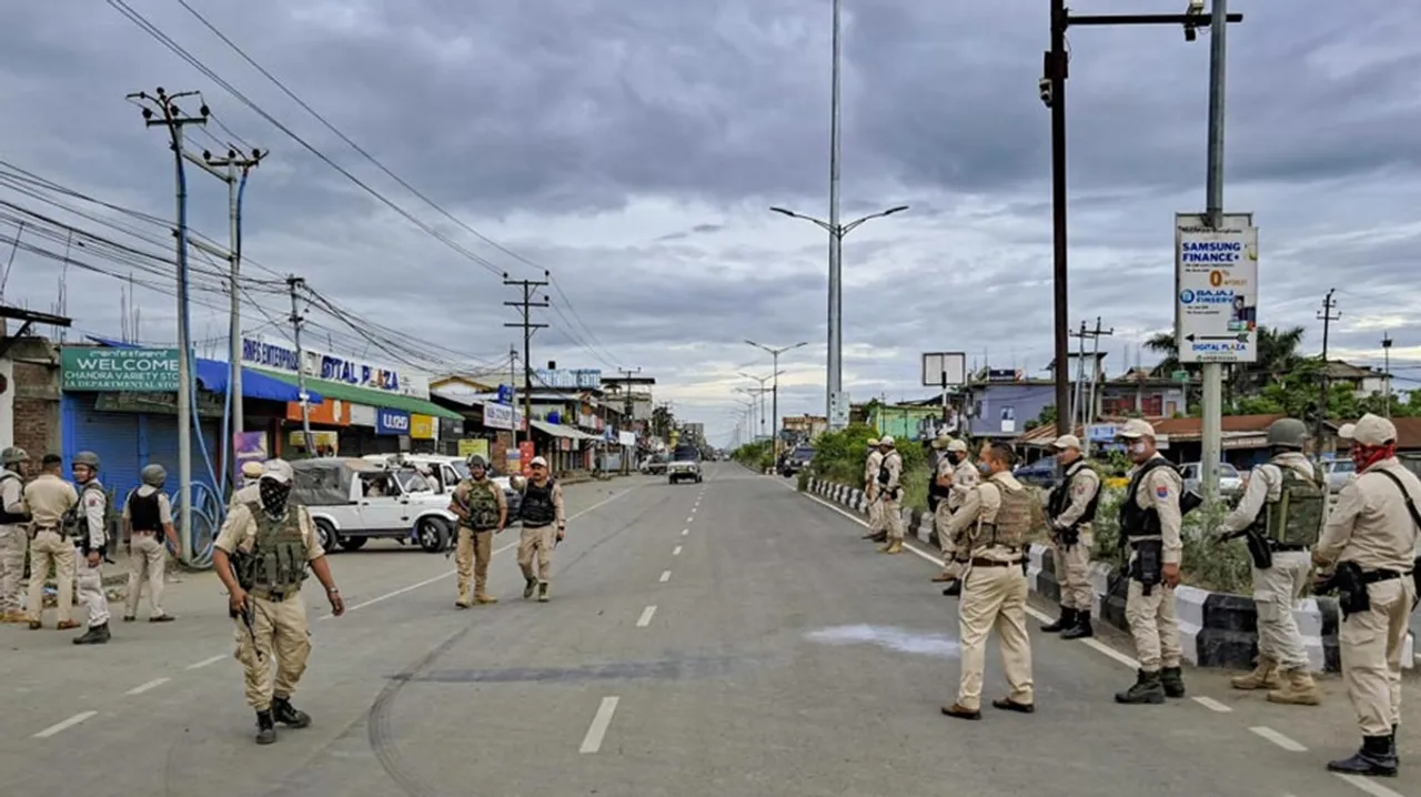police patrolling on a road in Manipur