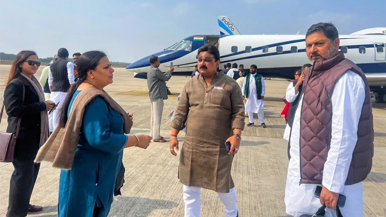 MLAs of the JMM-led alliance in Jharkhand board a flight for Hyderabd, in Ranchi, Friday, Feb. 2, 2024.