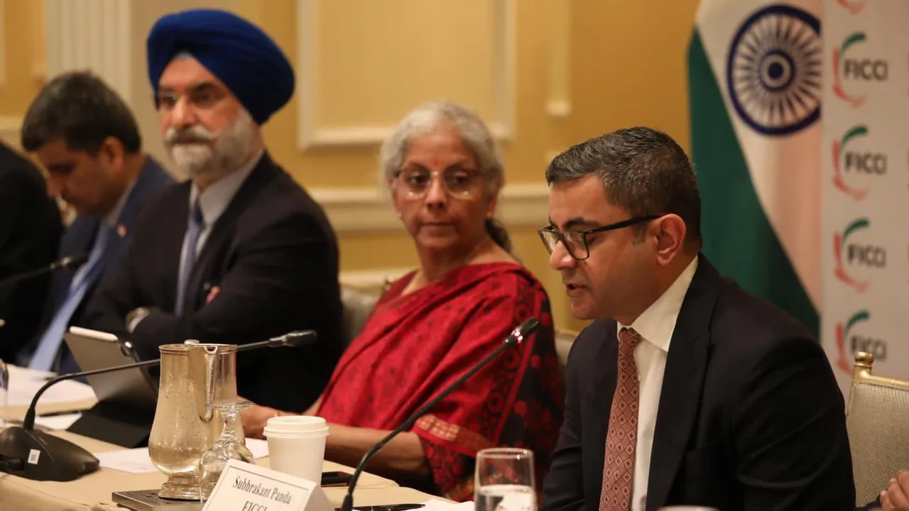 FICCI president Subhrakant Panda (right) with Finance Minister Nirmala Sitharaman at a roundtable meet in Washington DC