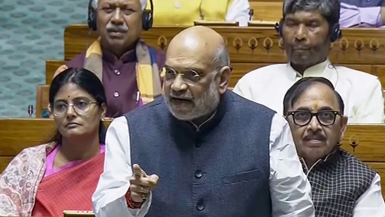 Union Home Minister Amit Shah speaks in the Lok Sabha during the Winter session of Parliament