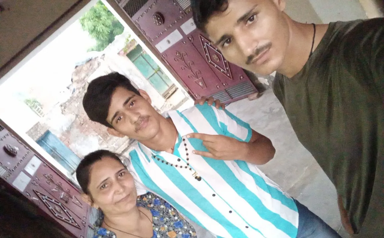 Arjun Singh (in blue stripes) with mother Yogita Bala and brother Vishal
