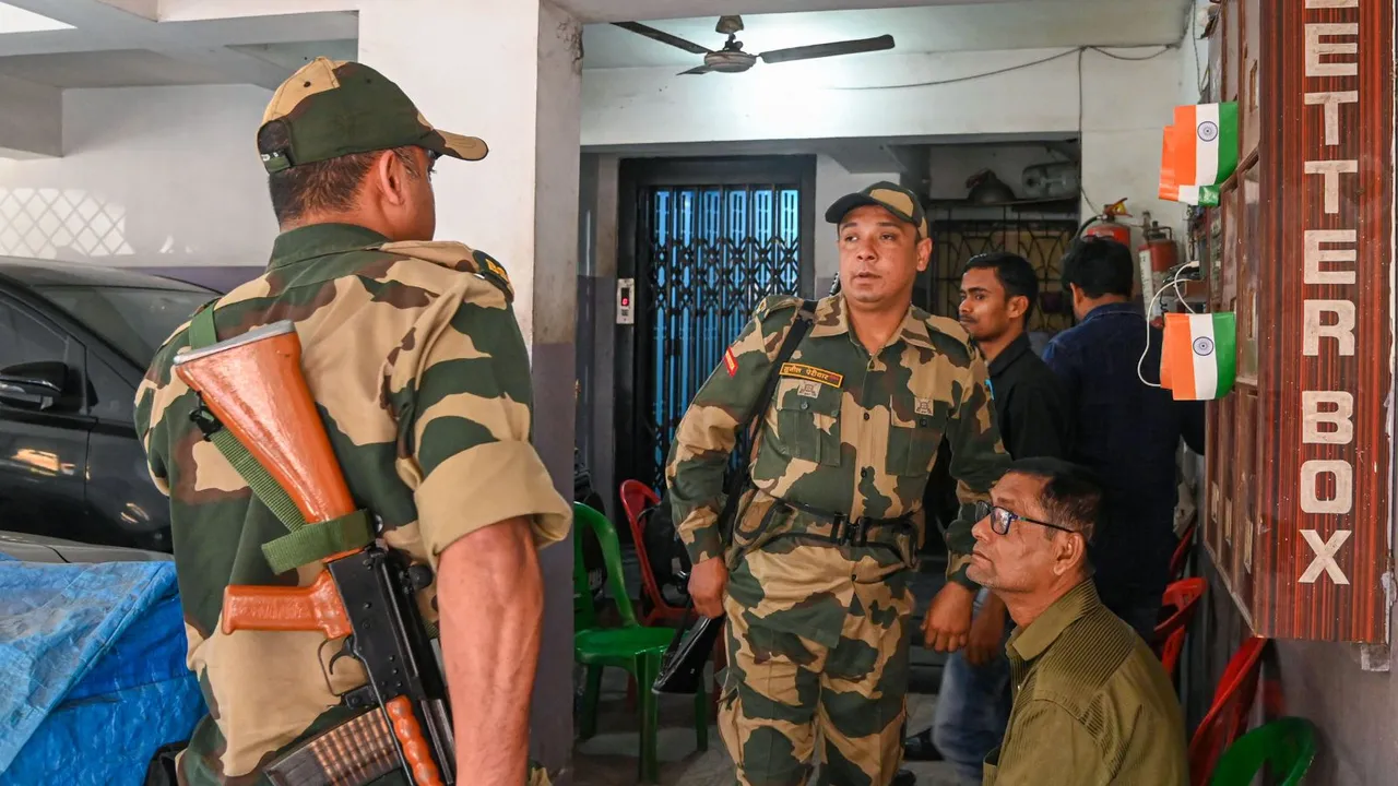 Security personnel at the residence of Swarup Biswas, brother of West Bengal Minister Aroop Biswas, during a raid by Income Tax department officials, in Kolkata