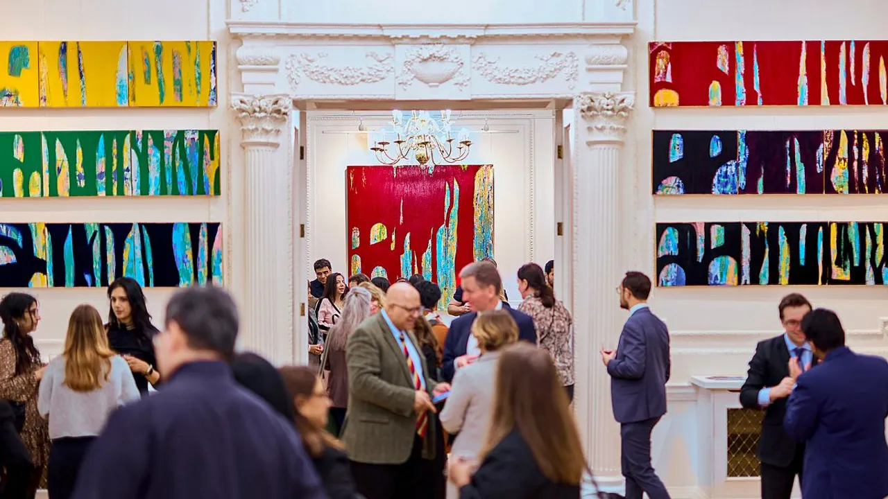 Visitors at Indian-origin artist Nanda Khiara's exhibition 'Legacy, Perception, and Cherry Blossom Chronicles', at the Nehru Centre, in London, UK