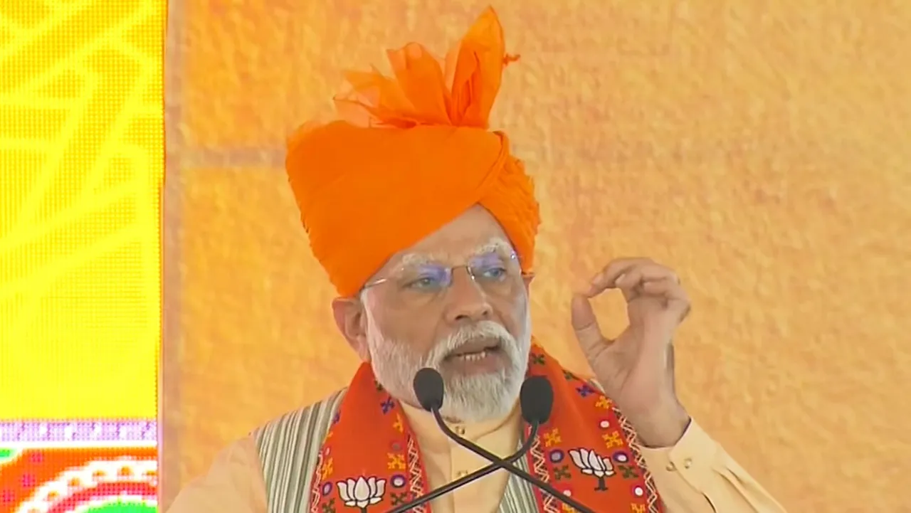 Prime Minister Narendra Modi speaks during a public meeting ahead of Rajasthan Assembly elections, in Bharatpur