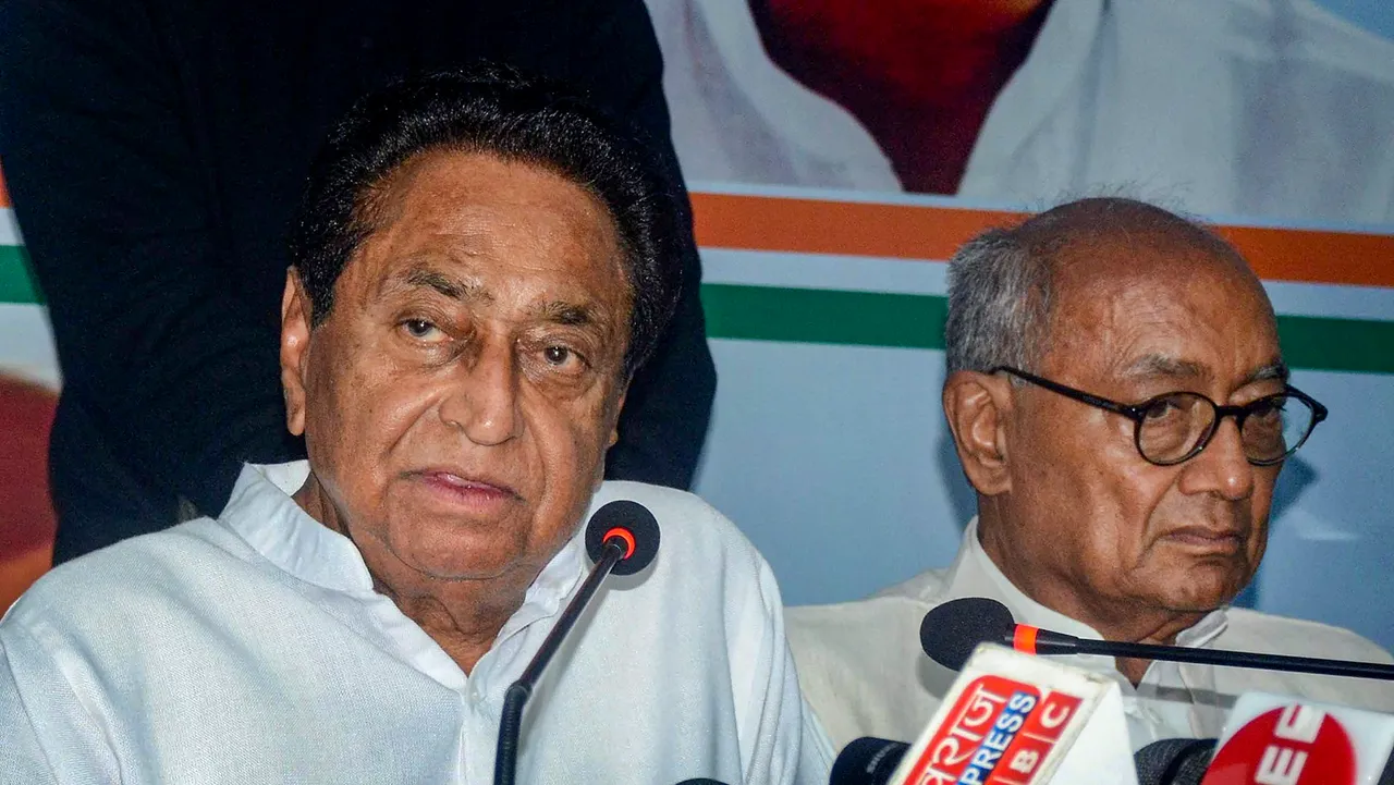 Madhya Pradesh Congress President Kamal Nath with party leader Digvijaya Singh during a press conference after party's defeat in MP Assembly elections, in Bhopal