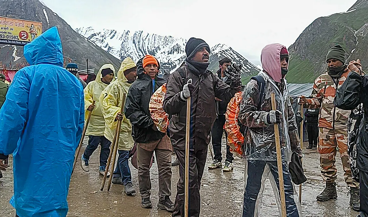 Pilgrims at Panchtarni base camp after the Amarnath Yatra was temporarily suspended for third consecutive day due to bad weather, in Anantnag district, Sunday.jpg