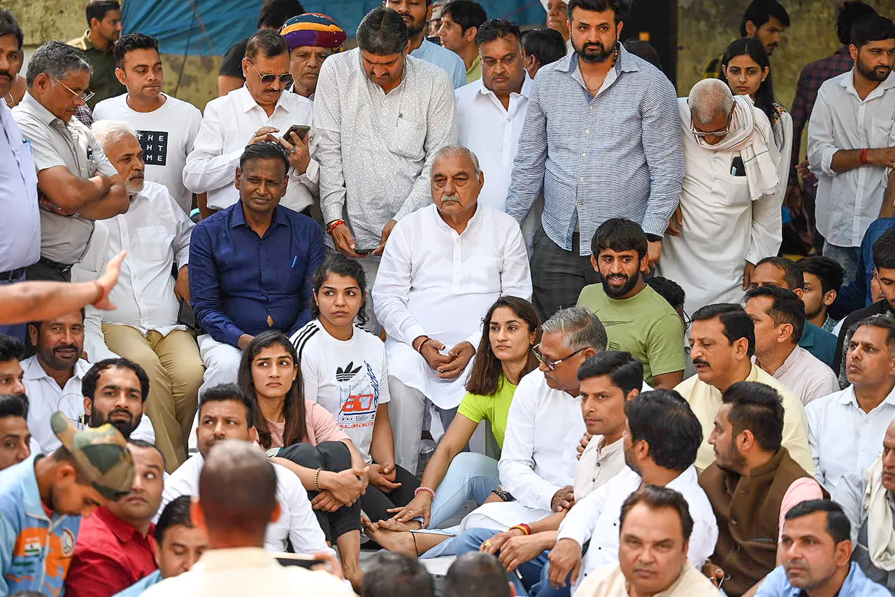 Former Haryana chief minister and Congress leader Bhupinder Singh Hooda with wrestlers Vinesh Phogat, Sakshi Malik, Bajrang Punia and others during their protest at Jantar Mantar