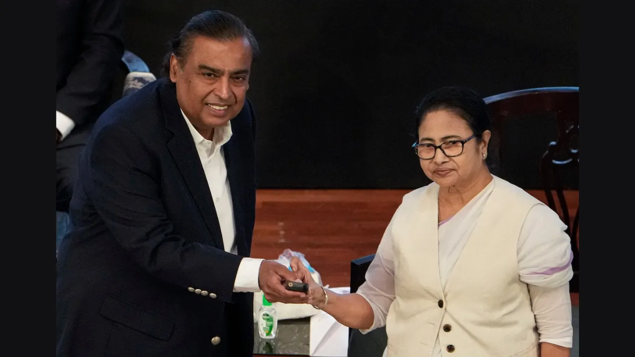 Mamata Banerjee and Reliance Industries Chairperson Mukesh Ambani during the inaugural session of the 7th Bengal Global Business Summit, in Kolkata, Tuesday, Nov. 21, 2023. 