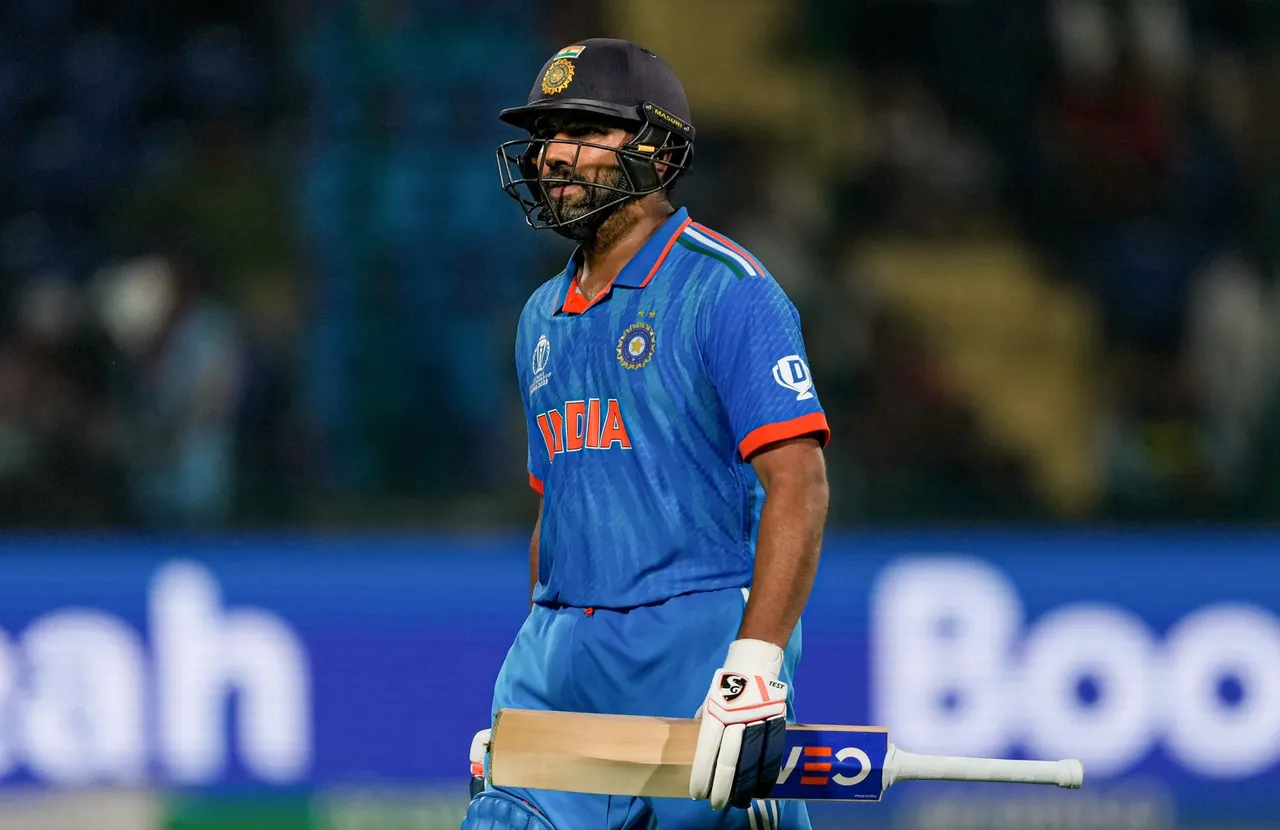 India's Rohit Sharma walks off the field after losing his wicket during the ICC Men's Cricket World Cup 2023 match between India and Afghanistan