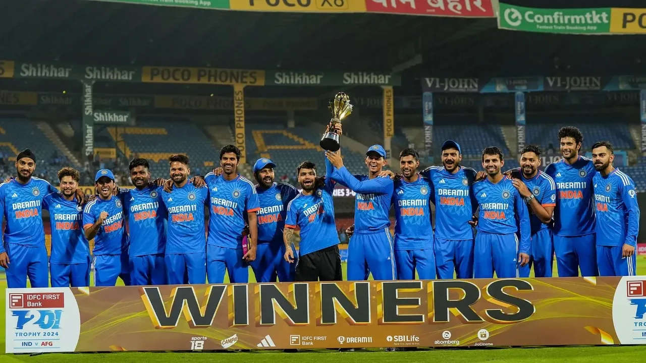 Indian team players pose with the tournament trophy after winning the third T20 cricket match against Afghanistan