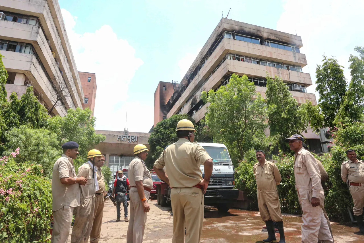 Additional Director General of Police, Fire, Ashutosh Roy with his team inspects the Satpura Bhawan, a day after a fire incident, in Bhopal