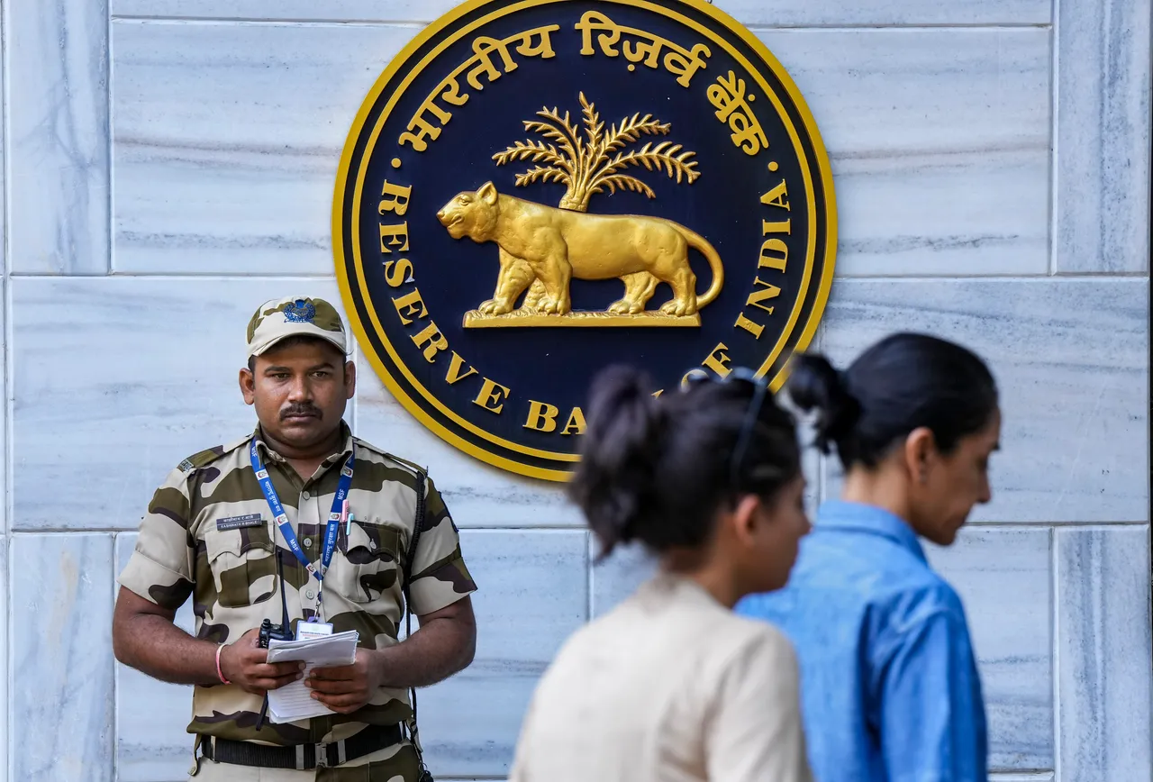 A security personnel stands guard outside the Reserve Bank of India (RBI) headquarters, in Mumbai