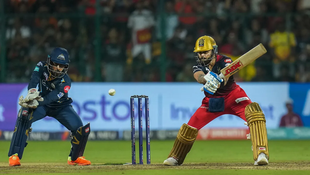 Royal Challengers Bangalore batter Virat Kohli plays a shot during the IPL 2023 cricket match between Royal Challengers Bangalore and Gujarat Titans at M Chinnaswamy Stadium in Bengaluru on May 21