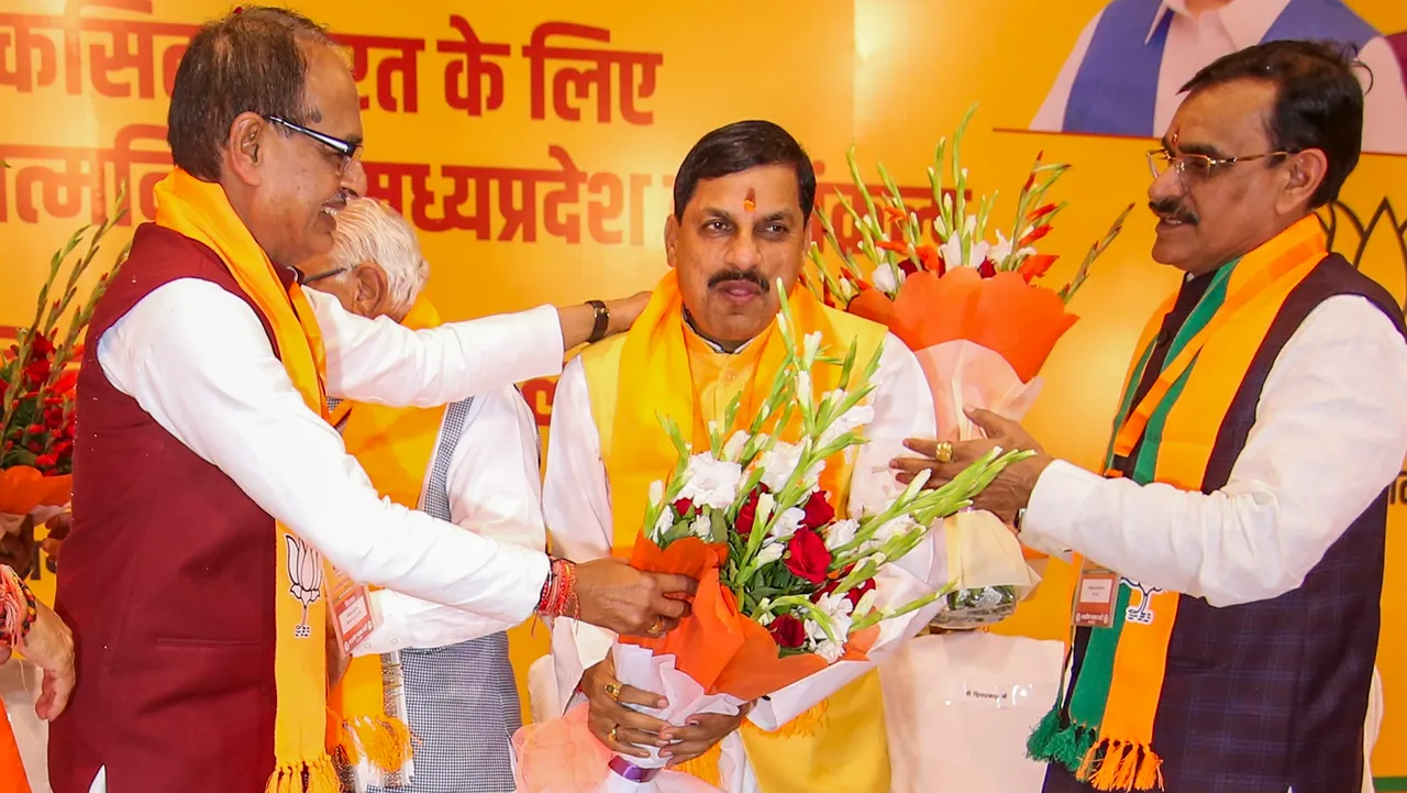 BJP MLA from Ujjain South Mohan Yadav being greeted by Madhya Pradesh CM Shivraj Singh Chouhan and state President VD Sharma on his election