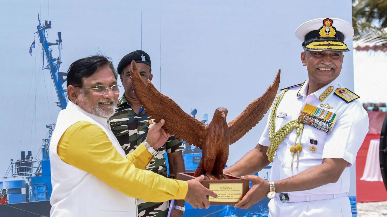 Chief of the Naval Staff Admiral R. Hari Kumar presents a memento to Lakshadweep Administrator Praful Khoda Patel during the commissioning of naval base 'INS Jatayu', in Minicoy, Lakshadweep Islands