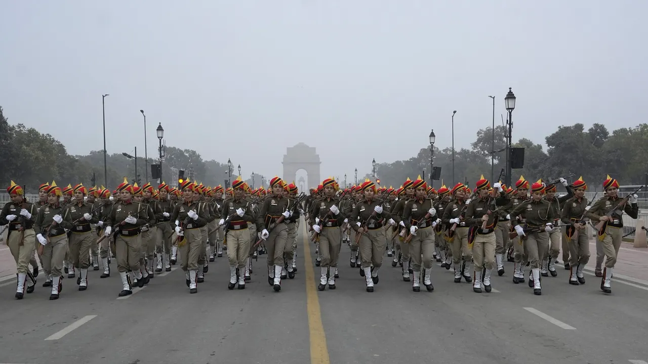 Women personnel of Delhi Police during rehearsals for the upcoming Republic Day parade amid fog on a cold winter morning, in New Delhi