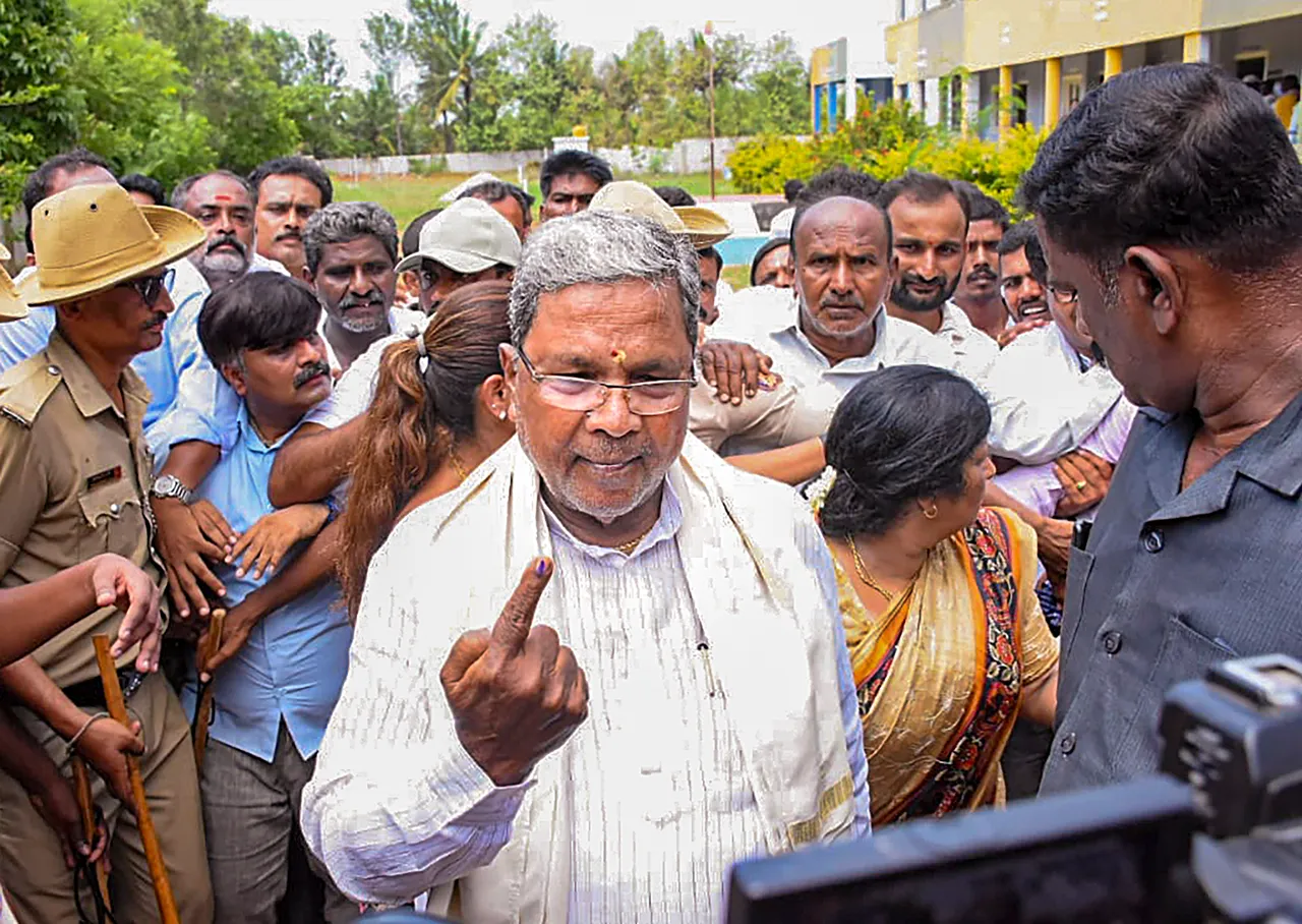 Former Karnataka CM Siddaramaiah after casting his vote for Karnataka Assembly elections, at a polling station, at Varuna in Mysuru district