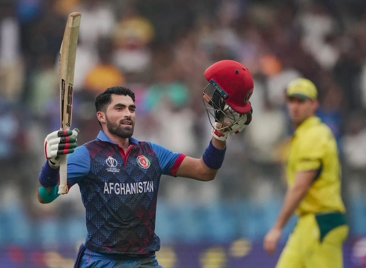 Afghanistan's Ibrahim Zadran celebrates his century during the ICC Men's Cricket World Cup 2023 match