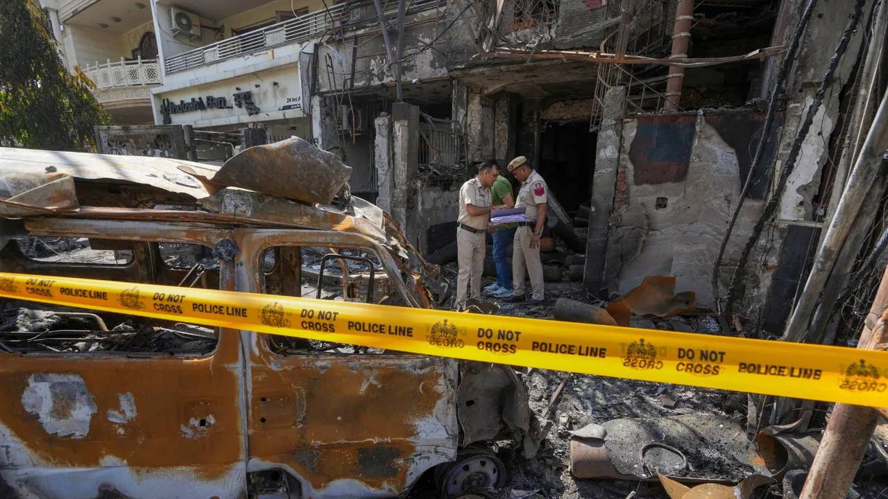 Policemen outside a children's hospital where a fire broke out on Saturday night at Vivek Vihar area, in New Delhi, Sunday, May 26, 2024