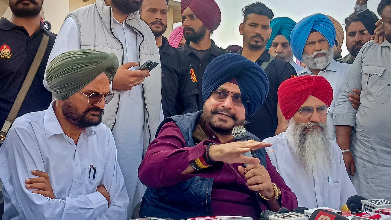 Congress leader Navjot Singh Sidhu with slain singer Sidhu Moosewala's father Balkaur Singh speaks to media in Mansa on April 3